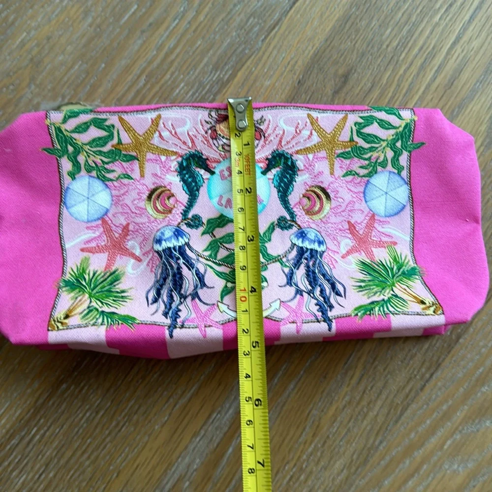 Estée Lauder pink zippered cosmetic bag with sea creatures and tropical trees